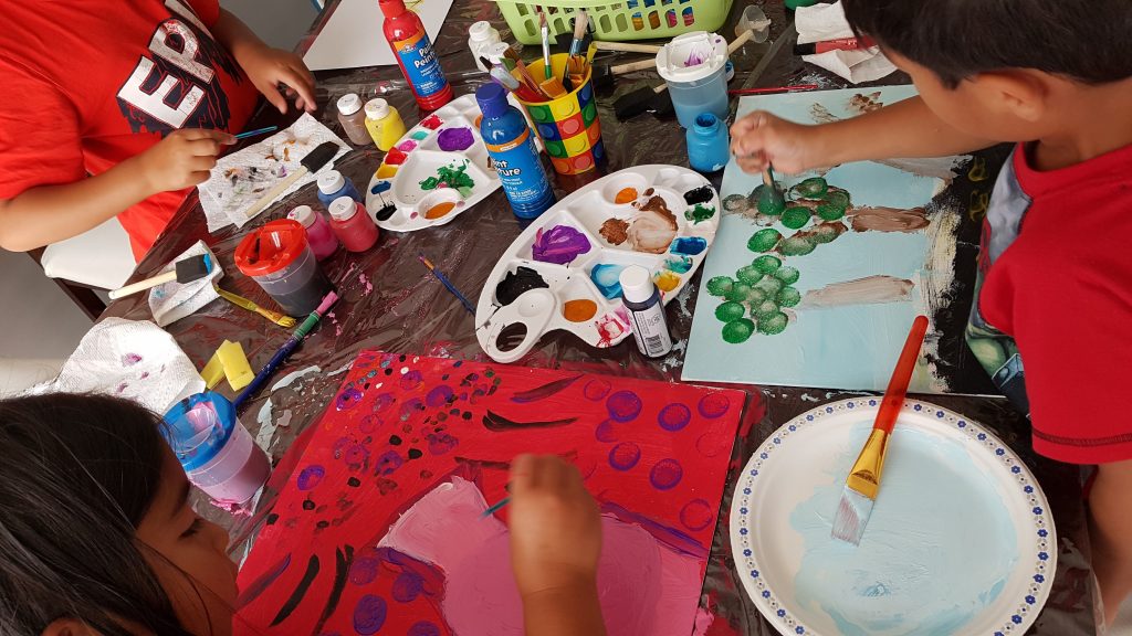 Kids doing artwork, painting