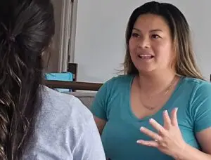 woman talking to another woman