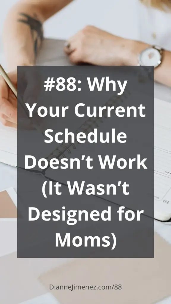 A woman is writing in her scheduler or planner